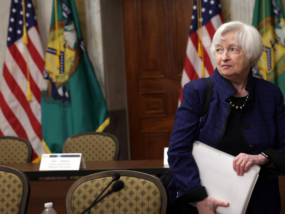 Treasury Secretary Janet Yellen leaves a meeting on April 21. She warns that economic chaos will ensue if Congress doesn't raise the debt ceiling in the coming weeks.