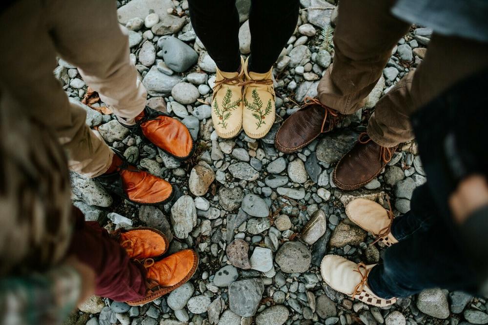 A family photo shows Jamie Gentry's family in their moccasins.
