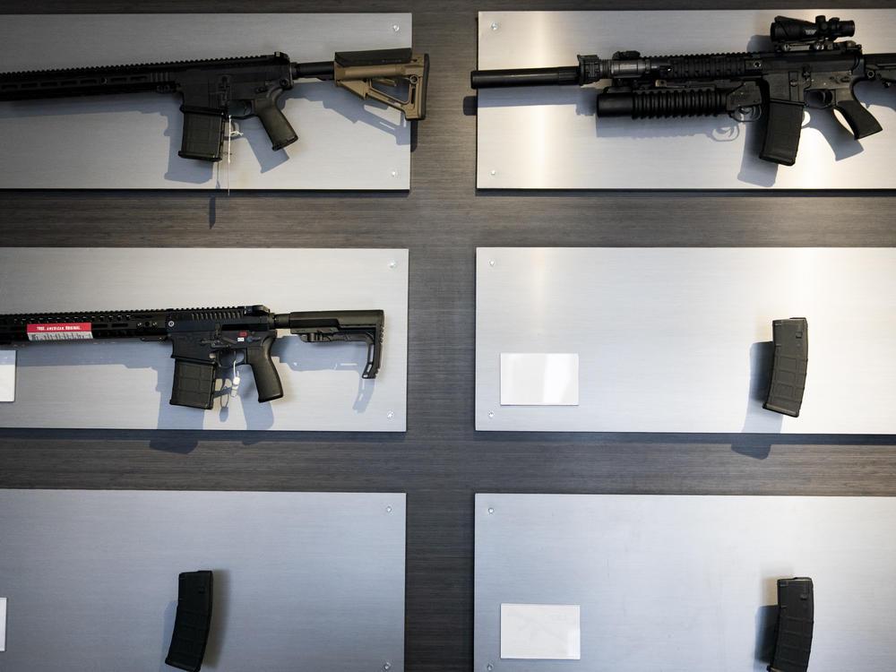 AR-15-style rifles are displayed at Rainier Arms on April 14 in Auburn, Wash.
