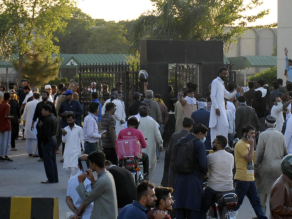 Supporters of Pakistan's former Prime Minister Imran Khan block an entry gate of the Pakistani army's headquarters during a protest against the arrest of their leader, in Rawalpindi, Pakistan, Tuesday. Khan was arrested as he appeared in court to face charges in multiple graft cases, a dramatic escalation of political tensions that sparked violent demonstrations in major cities.