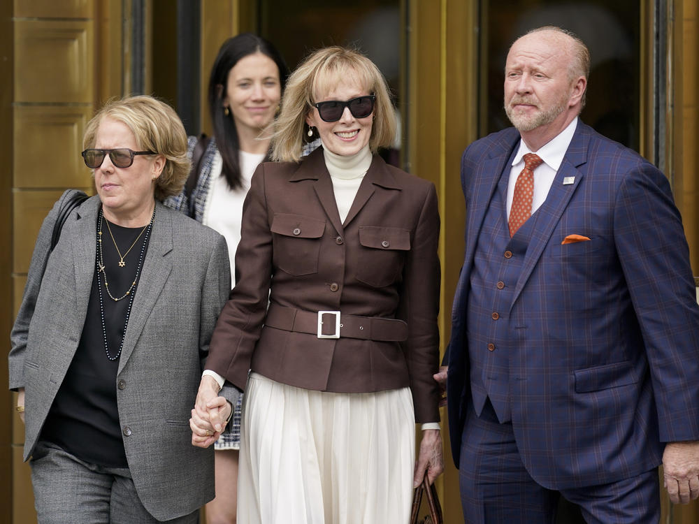 E. Jean Carroll (center) departs the Manhattan courthouse where a jury awarded her $5 million after finding former President Donald Trump liable for sexually abusing her in the mid-1990s.