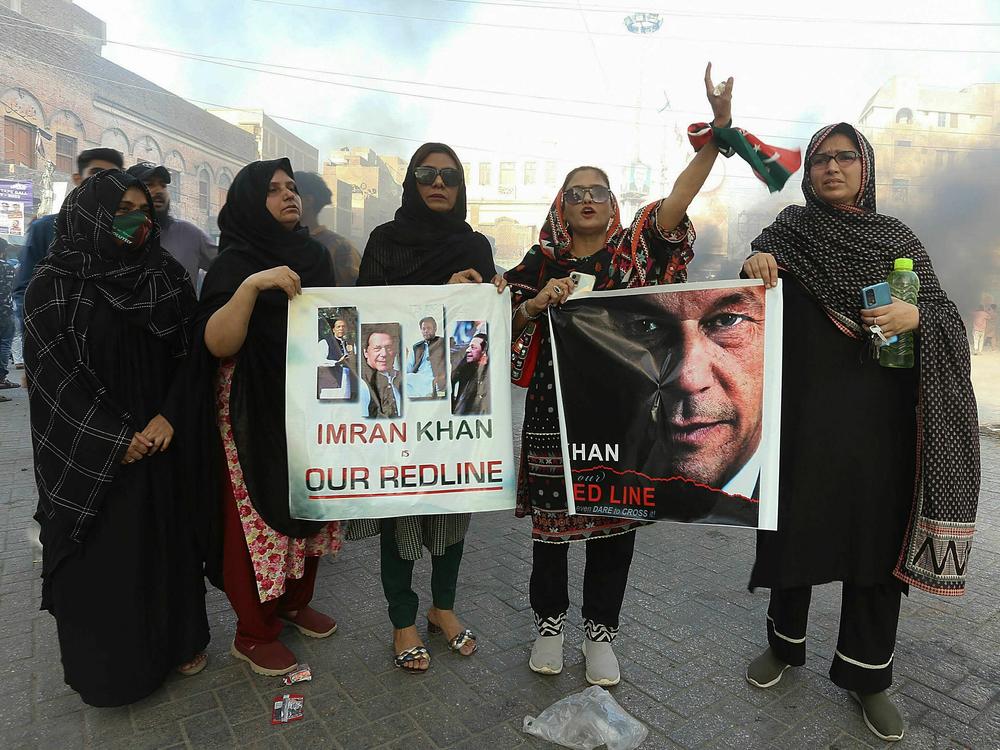 Pakistan Tehreek-e-Insaf party activists and supporters of former Prime Minister Imran Khan block a road during a protest against the arrest of their leader in Hyderabad, Pakistan, on Tuesday.