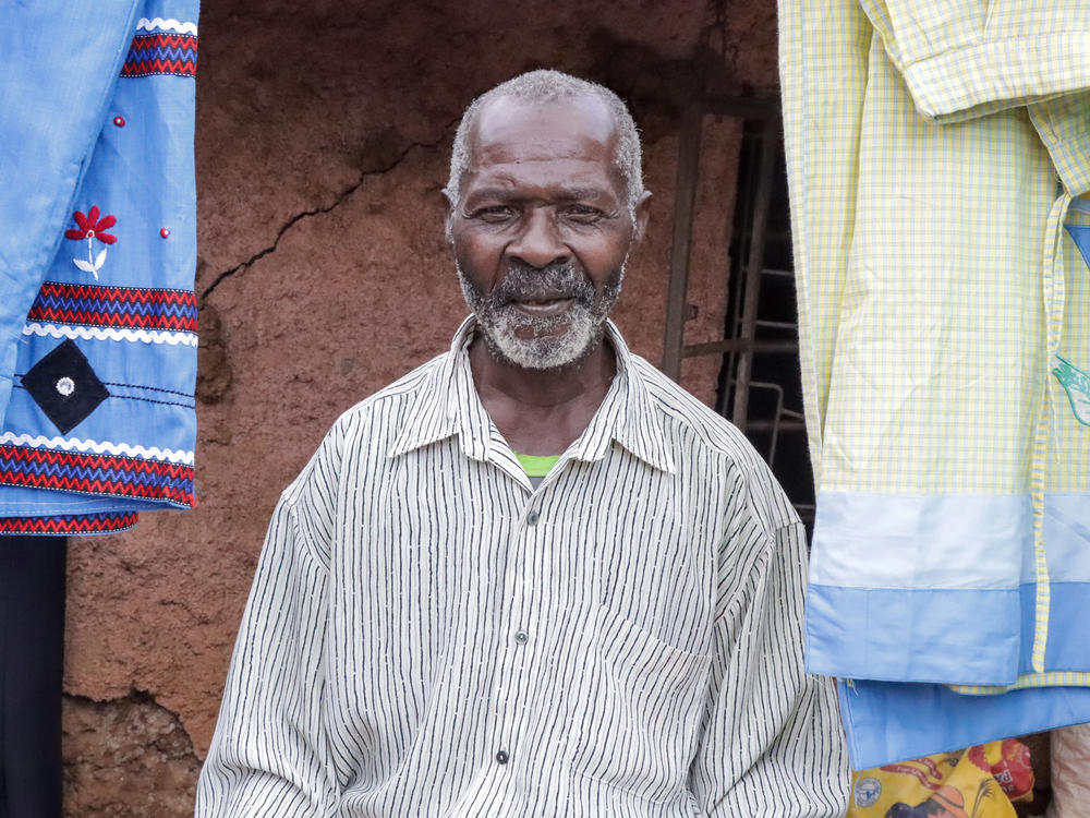 Abdala Hamadi lost his job as a waiter during the pandemic and now sells used books and clothes at a stall in the Kibera market. 