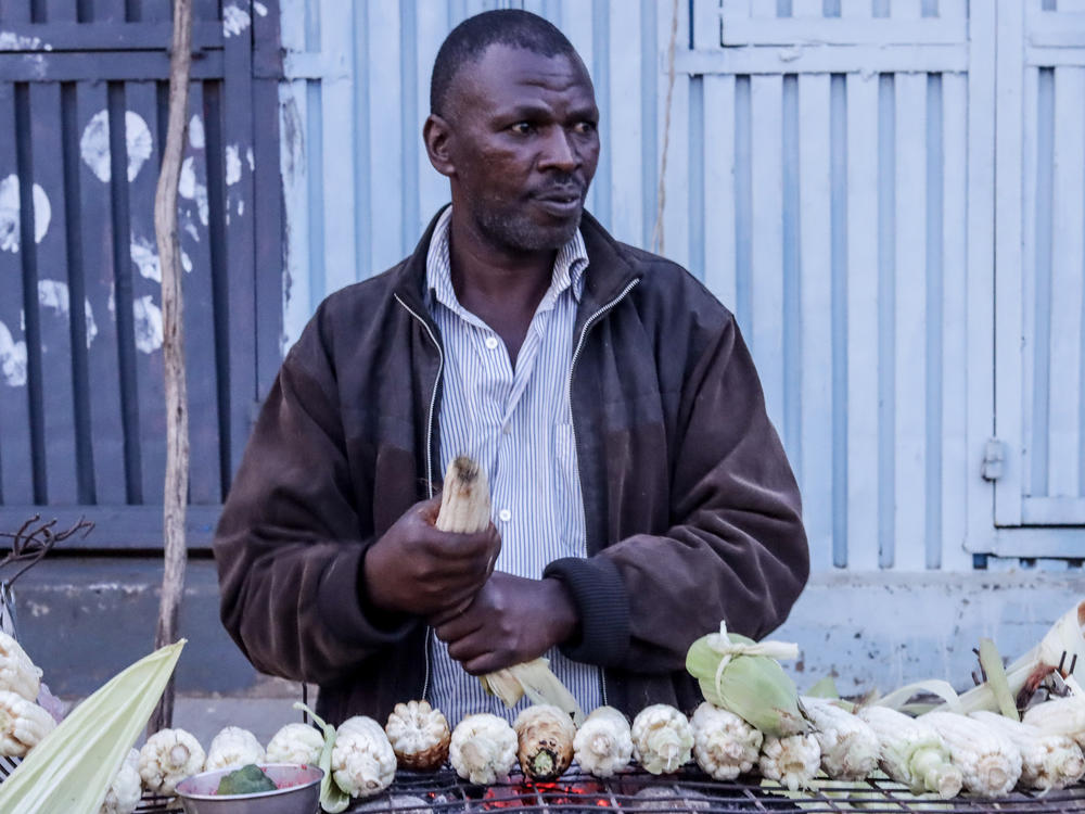 Stanley Ngugi buys supplies of maize to sell in Kibera. During the pandemic, his income dried up. 