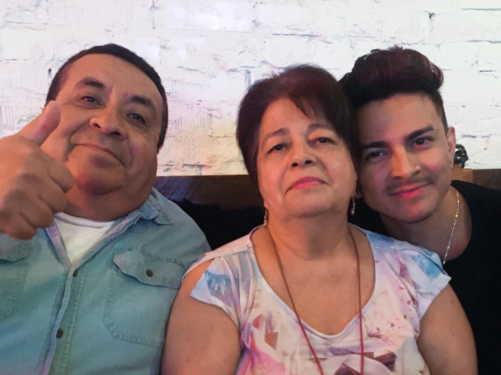 Miguel Lerma, right, with his grandparents who raised him, Jose and Virginia Aldaco.