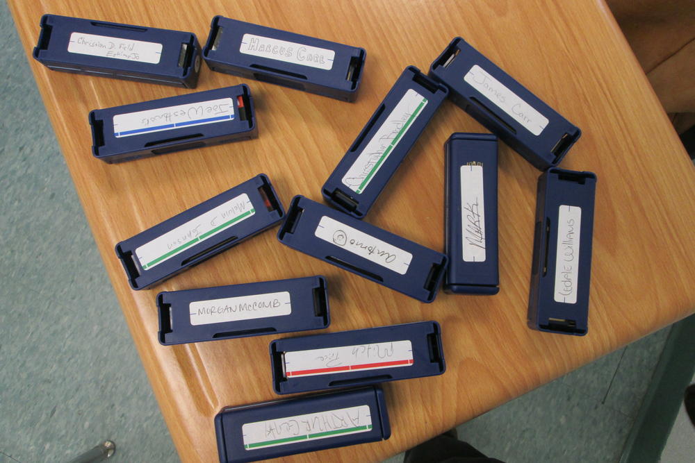 The Hohner Company donated blues harmonicas to Professor Gussow's students, but they can only practice once a week in class. They're forbidden to take the harmonicas back to their living quarters.