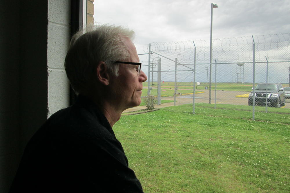 Professor Adam Gussow looks out the window of his classroom inside the sprawling Mississippi State Penitentiary, located on 28 square miles of the Mississippi Delta.