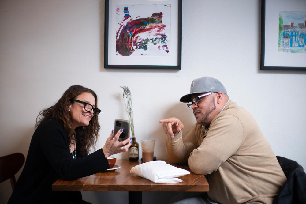 Tacuma Jackson catches up with Aliza Kaplan over coffee at Stumptown Coffee Roasters in Portland, Ore., on April 19. Kaplan is a law professor at Lewis & Clark Law School and assisted Jackson with his clemency.