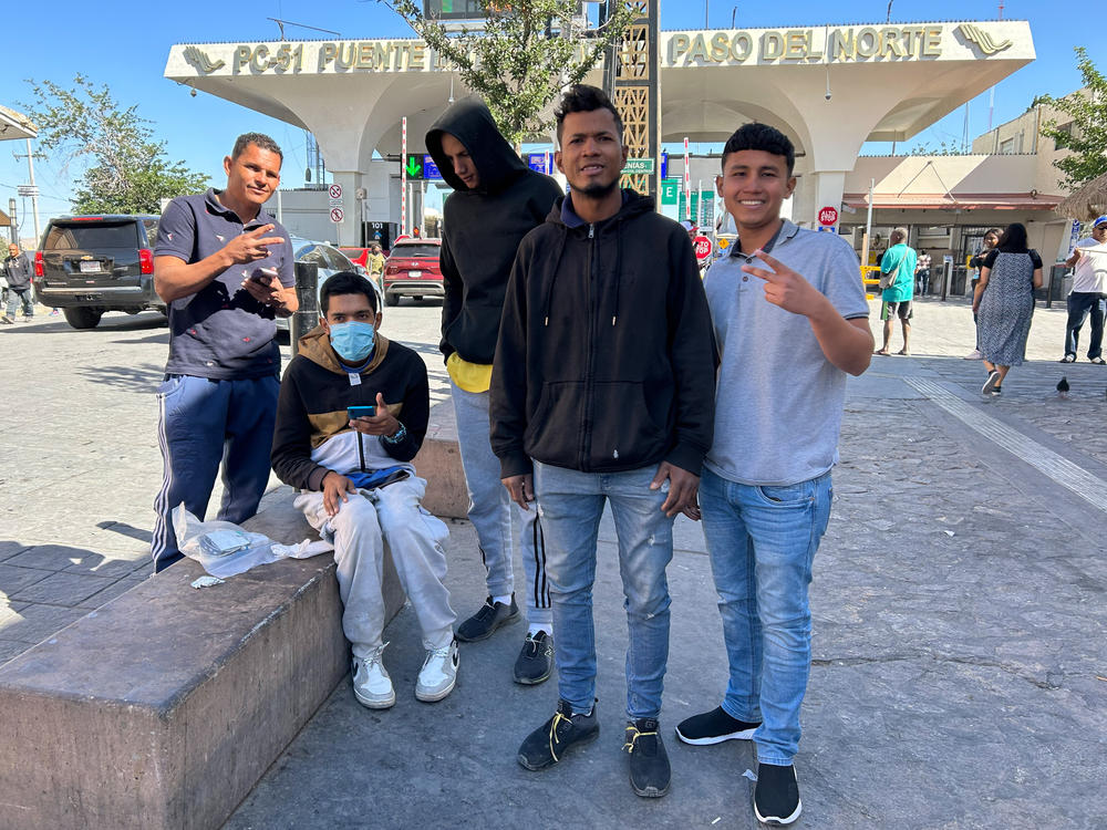 A group of Venezuelan men, including Luis Suárez and Carlos Carrillo Zambrano (pictured in the foreground) at the Paso del Norte International Bridge in Ciudad Juárez, Mexico. They are among many migrants who say that the CBP One app remains riddled with glitches despite a recent update.