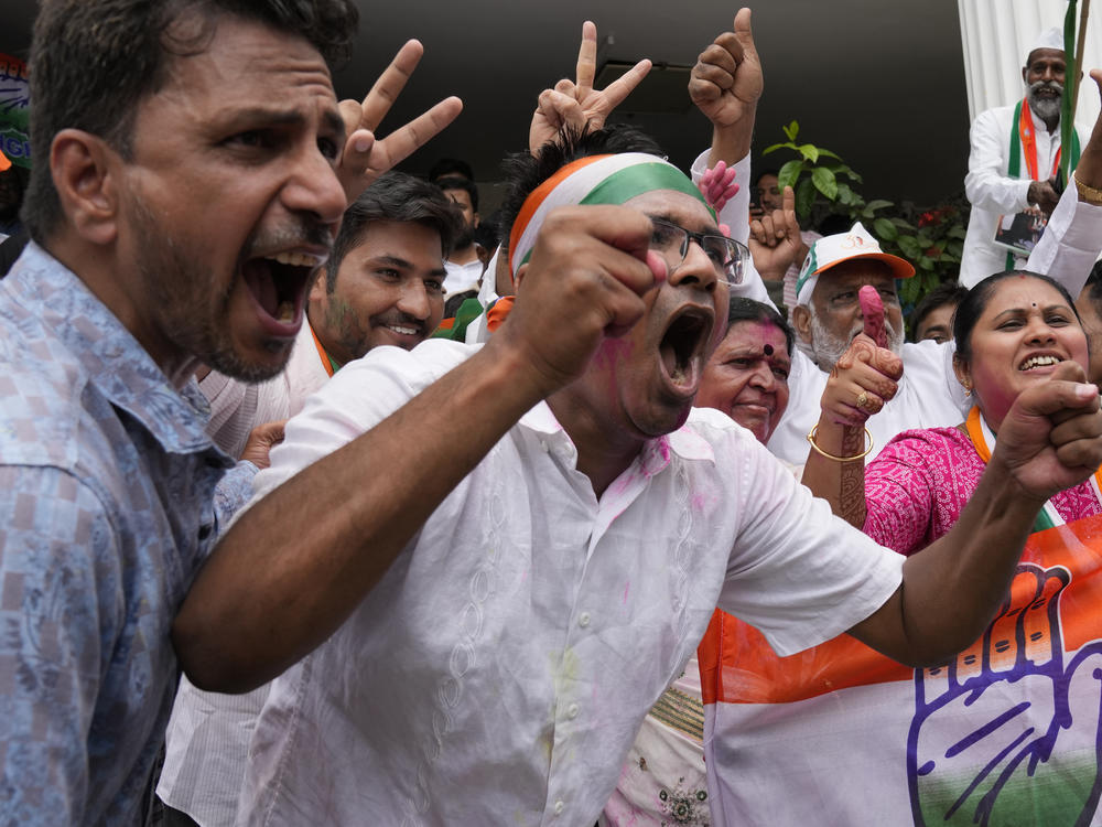 Supporters of the opposition Congress party celebrate early leads in the Karnataka state elections in Bengaluru, India, on Saturday.