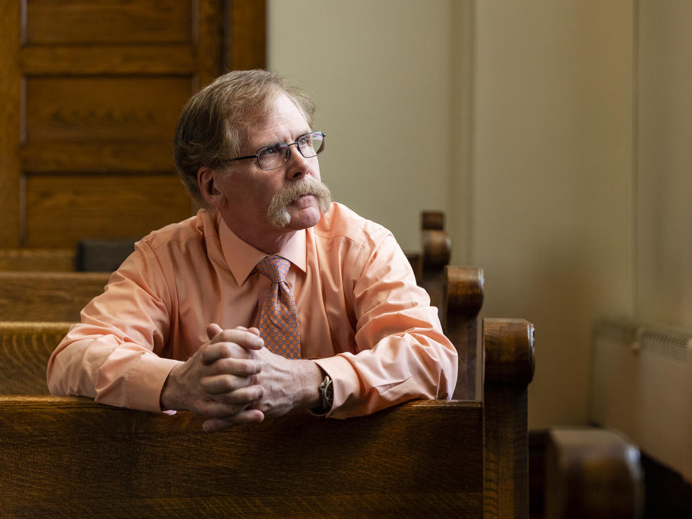 Pastor Douglas Theobald, who has been at Struthers United Methodist Church for more than a decade, poses for a portrait on Sunday at the church in Struthers, Ohio.