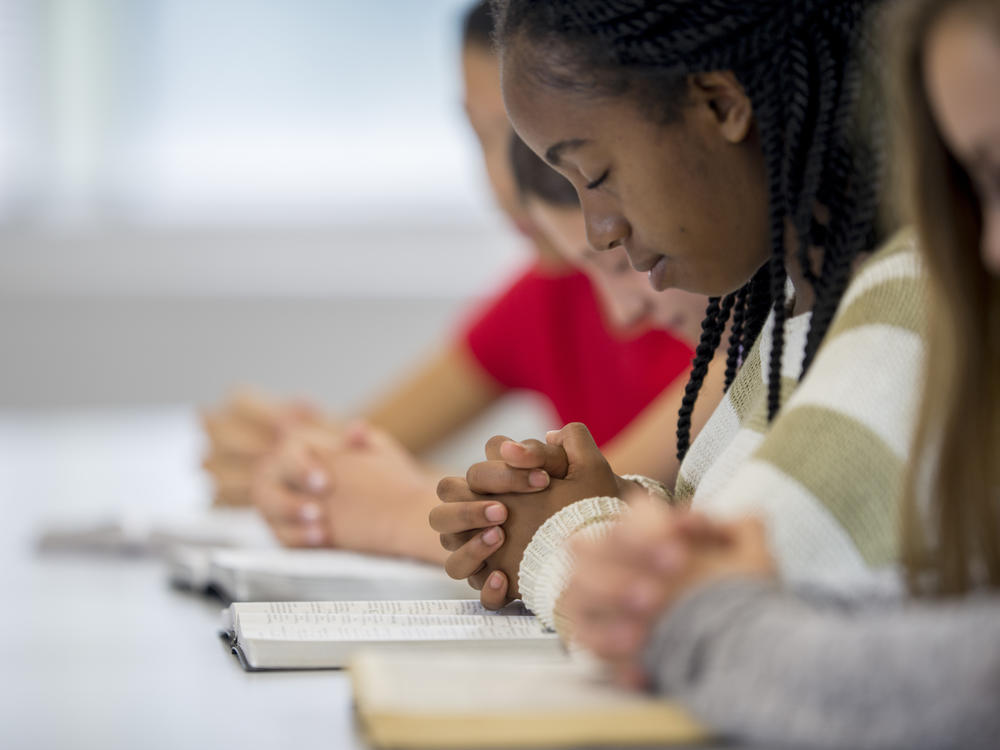 New guidance from the Department of Education says a school may take reasonable measures to ensure students aren't pressured to join in their teachers' or coaches' prayers.