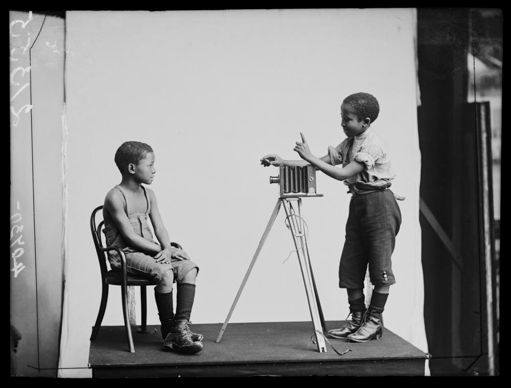 South African singers Albert Jonas and John Xiniwe, of The African Choir, in a staged photographic portrait.