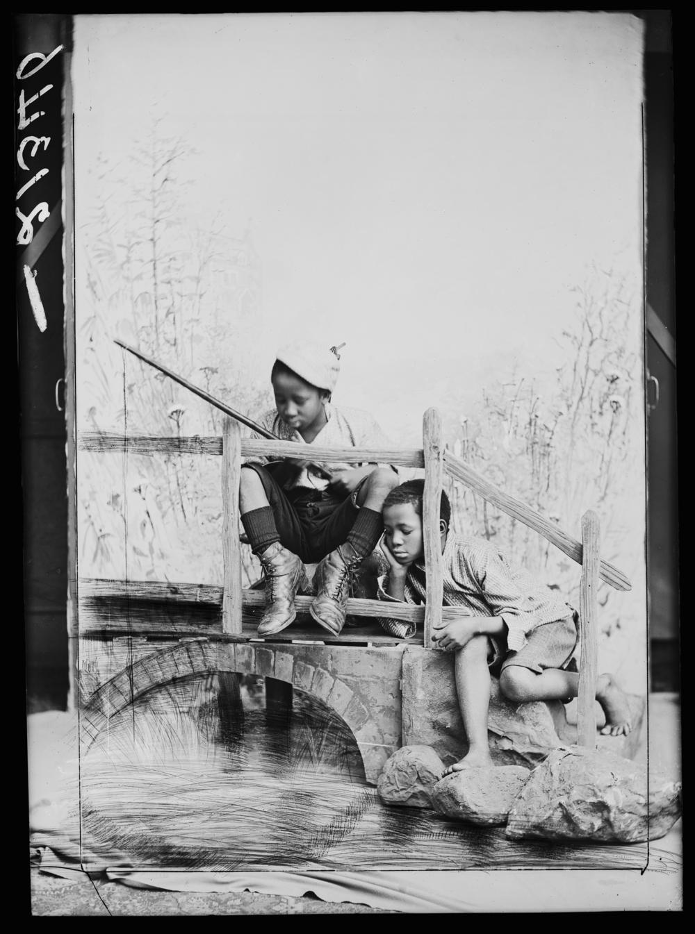 South African singers Albert Jonas and John Xiniwe, of The African Choir, in a staged fishing scene, 1891. The choir, drawn from seven different South African tribes, toured Britain from 1891 to 1893 to raise funds for a technical college in their home country.