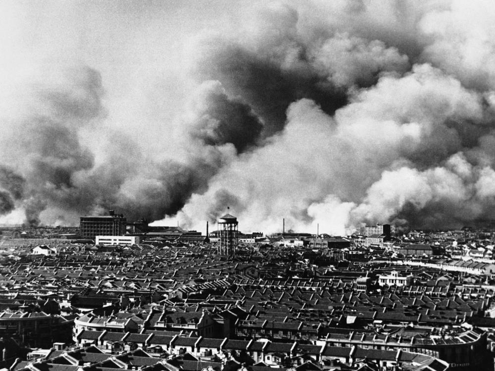 The skyline is consumed with fire and smoke in Shanghai, on Oct. 27, 1937.