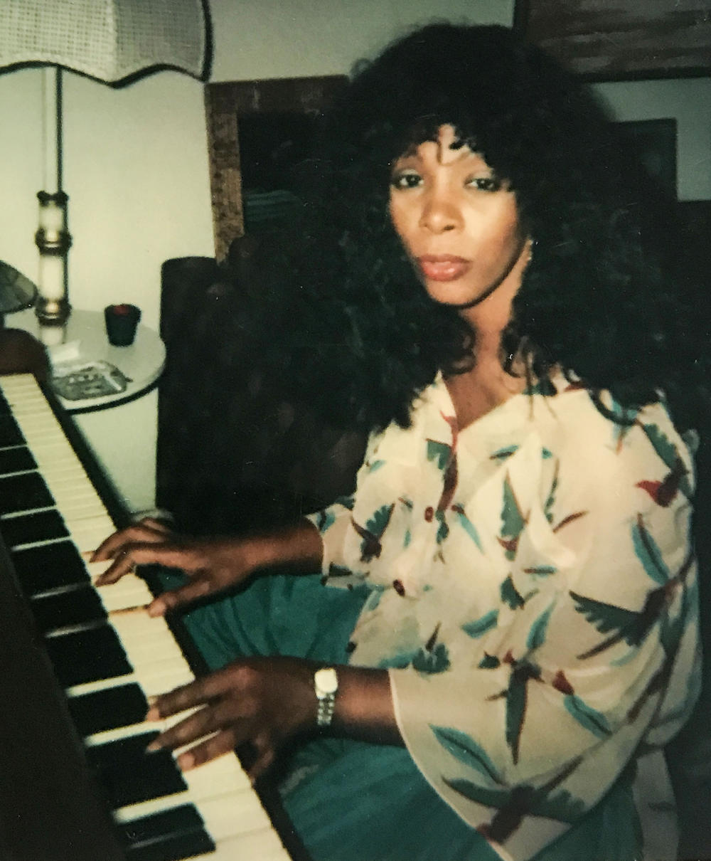 Summer at her piano.
