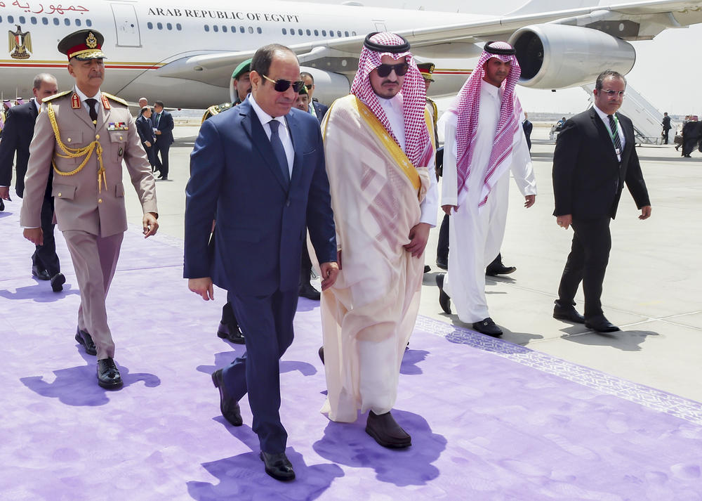 In this photo provided by Saudi Press Agency, Egyptian President Abdel-Fattah Sissi is accompanied by Saudi Prince Badr bin Sultan upon his arrival at Jeddah airport, Saudi Arabia, Thursday, ahead of the Arab summit.