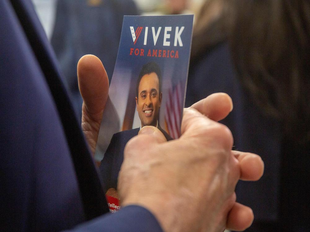 An event goer holds a pamphlet for U.S. entrepreneur and 2024 presidential hopeful Vivek Ramaswamy during the Iowa Faith and Freedom Coalition's Road to Victory Conference at the Horizon Events Center in Clive, Iowa, on April 22, 2023.