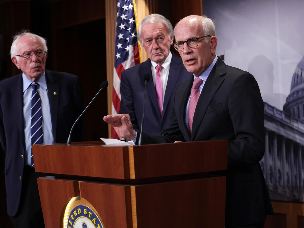 Democratic Sen. Peter Welch of Vermont, flanked by Sens. Bernie Sanders of Vermont and Ed Markey of Massachusetts, addressed concerns about debt limit negotiations during a press conference on Thursday. A group of Senate Democrats sent a letter to President Biden urging him to invoke the 14th Amendment to avoid a debt default if he can't reach a deal with Republicans.