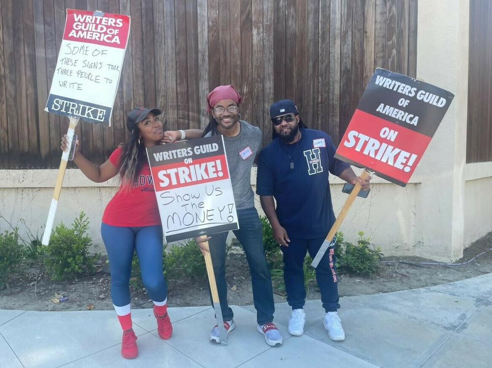 Striking writer Lanett Tachel (L) says, 
