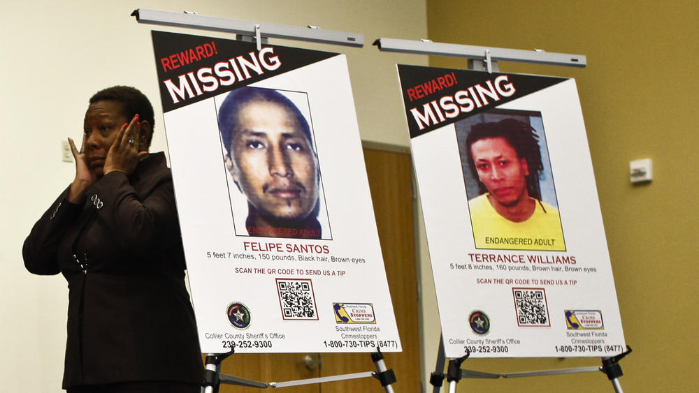 Marcia Williams reacts after an unidentified person comes forward with information about the disappearances during a press conference in 2013.