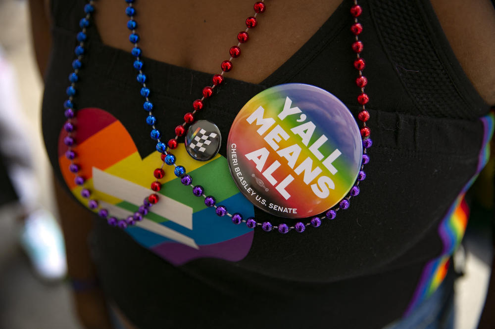 A woman wears a button during celebrations for Pride month on June 25, 2022, in Raleigh, North Carolina.