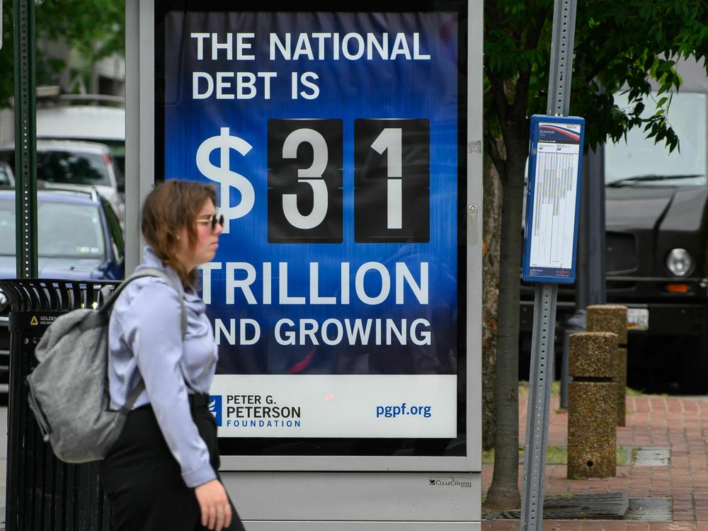 A poster on a bus shelter showing the national debt is seen in Washington, D.C., on Friday.