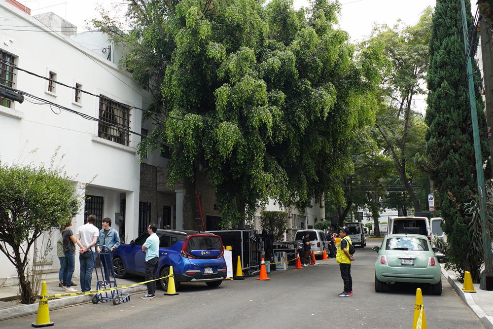 A production crew coordinates a shoot at a house in Mexico City's Condesa neighborhood, popular for tourists and remote workers.