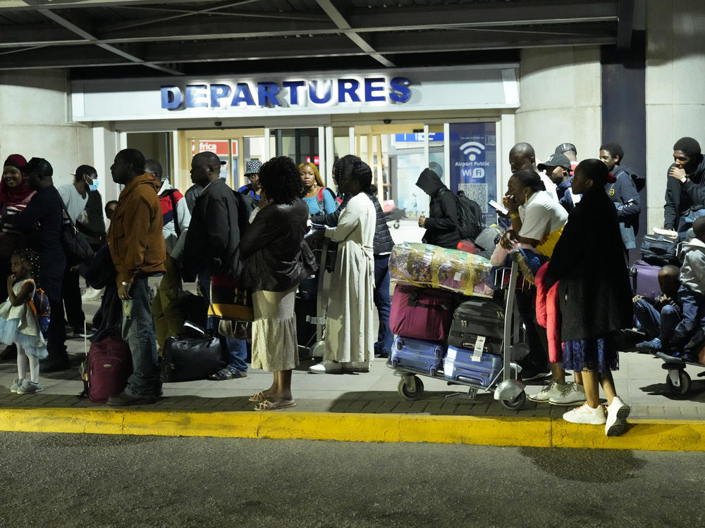 Evacuees from Sudan arrive at the Robert Mugabe International airport in Harare, Zimbabwe, on April, 28.