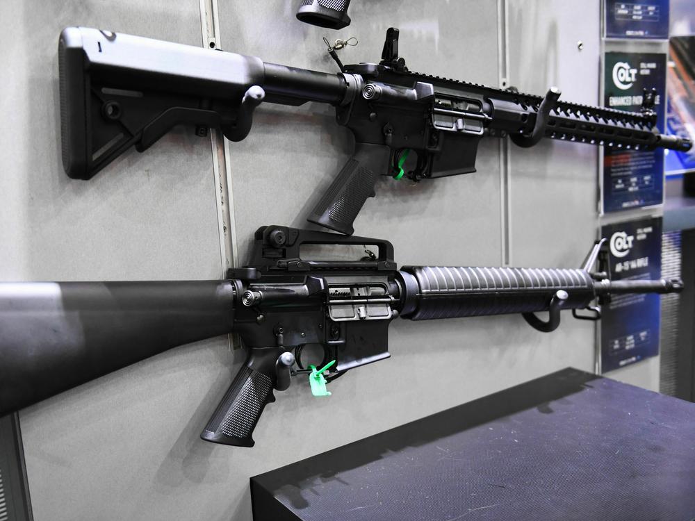 Colt M4 Carbine and AR-15 style rifles are displayed during the National Rifle Association (NRA) Annual Meeting in Houston, Texas on May 28, 2022. A Maryland man is causing concern for carrying an AR-15 style rifle near a school bus stop.