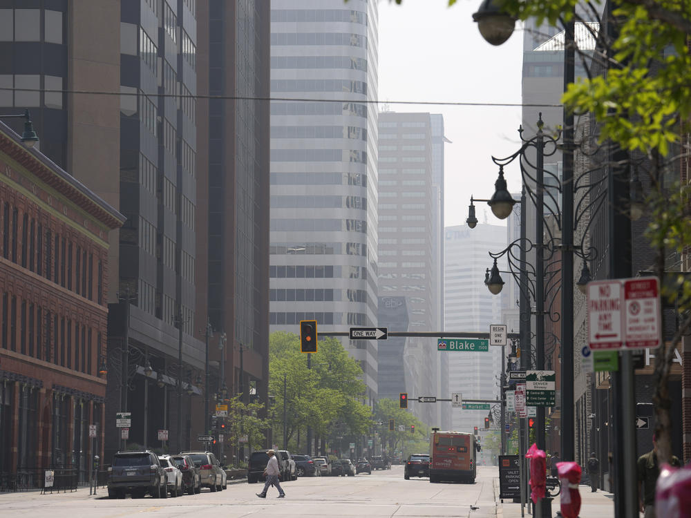 A smoky haze shrouds the high-rise buildings in downtown Denver on Saturday, May 20.
