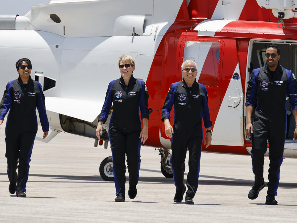 The crew of the SpaceX Falcon 9 rocket, with the Crew Dragon spacecraft, from left, Saudi Arabian astronaut Rayyanah Barnawi, commandeer Peggy Whitson, pilot John Shoffner and Saudi Arabian astronaut Ali al-Qarni arrive at the Kennedy Space Center in Cape Canaveral, Fla., before their launch to the International Space Station on Sunday.