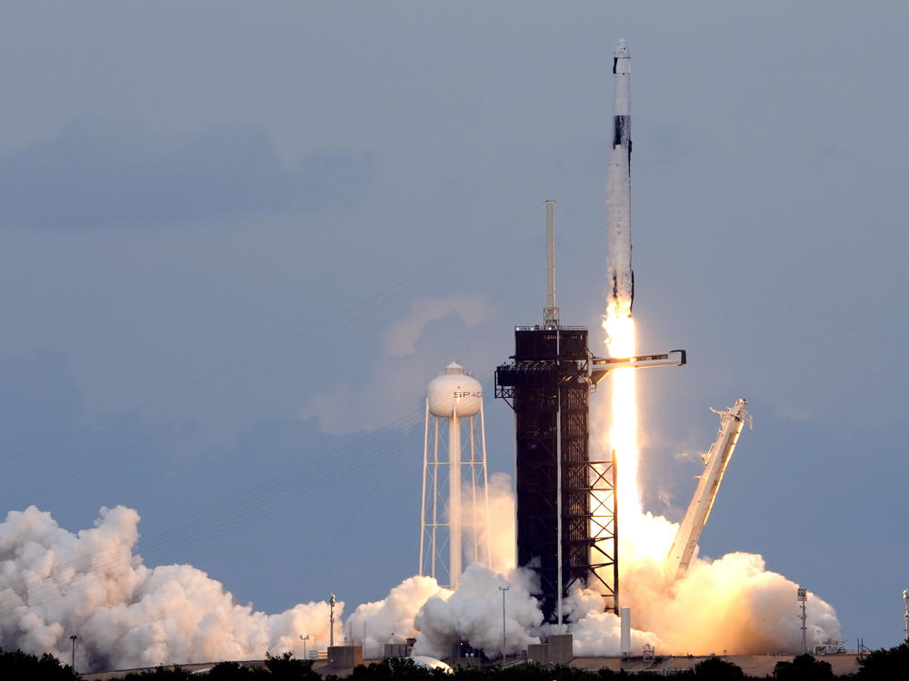 A SpaceX Falcon 9 rocket, with the Dragon capsule and a crew of four private astronauts lifts off from pad 39A, at the Kennedy Space Center in Cape Canaveral, Fla., on Sunday.