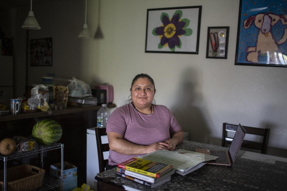 Yazmin Lopez is now the very parent she once read about in a book about personal finance: She has launched her children's credit history by adding them to her card.