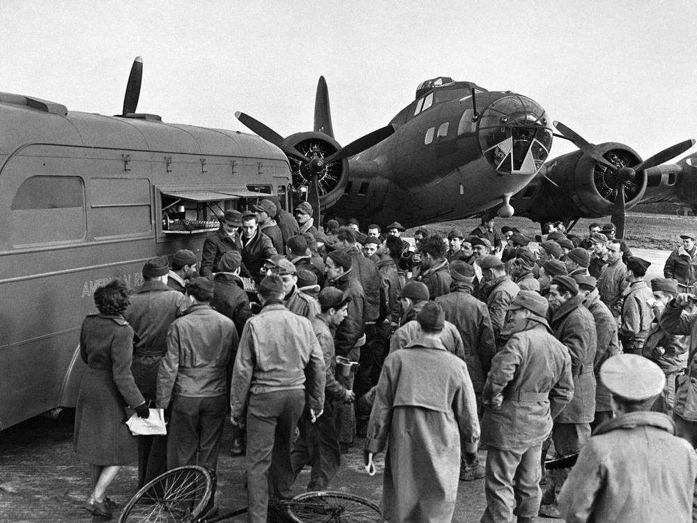 During World War II, the American Red Cross Clubmobile corps (shown here on an airfield in England in 1943) provided donuts, coffee and friendly conversation to the troops.