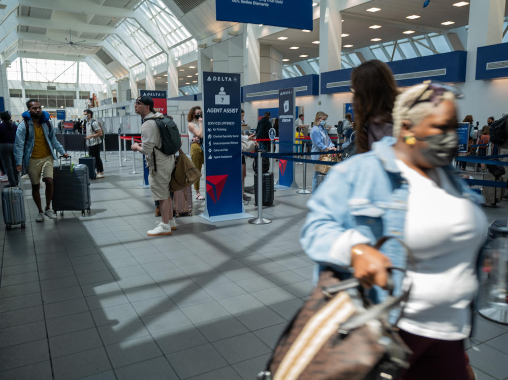 People travel through the terminal at John F. Kennedy Airport at the start of the Memorial Day weekend on May 27, 2022 in New York City. This coming Memorial Day is the start of a busy summer air travel season.