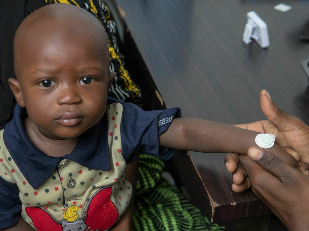 Study participants in The Gambia received a measles vaccine through a virtually pain-free sticker. Early data on adults and children as young as nine months suggest the syringe-free skin patch is safe and effective.