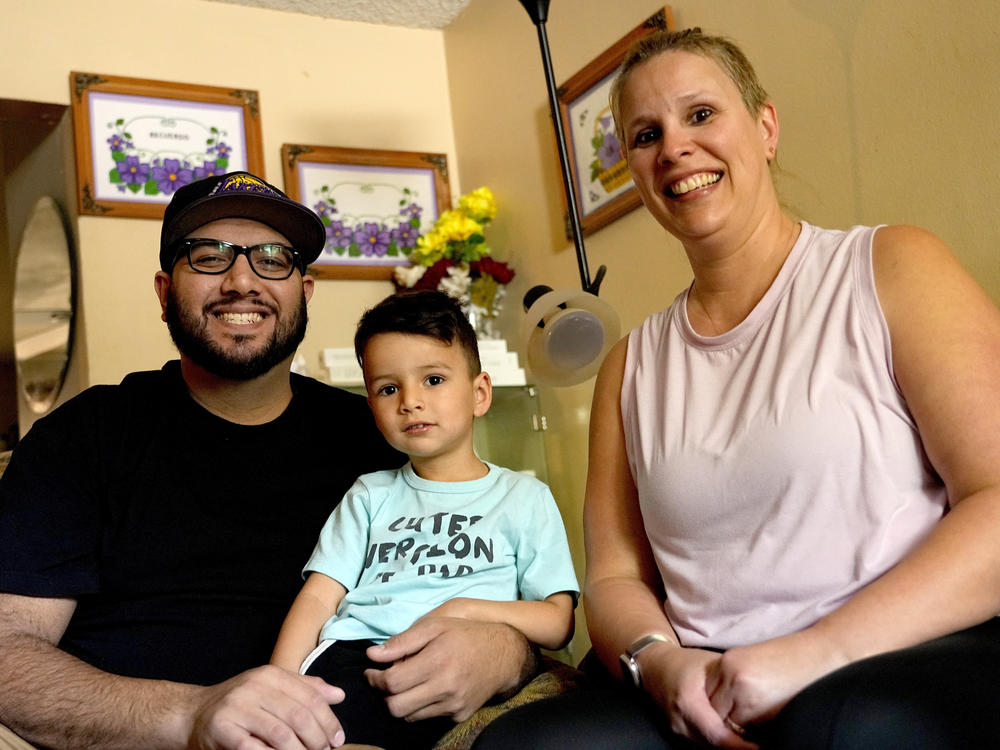 Alicia Celaya, David Cardenas and their son Adrian, 3, in Phoenix in April. Celaya and her family will lose their Medicaid coverage later this year, a result of a year-long nationwide review of the Medicaid enrollees that will require states to remove people whose incomes are now too high for the program.