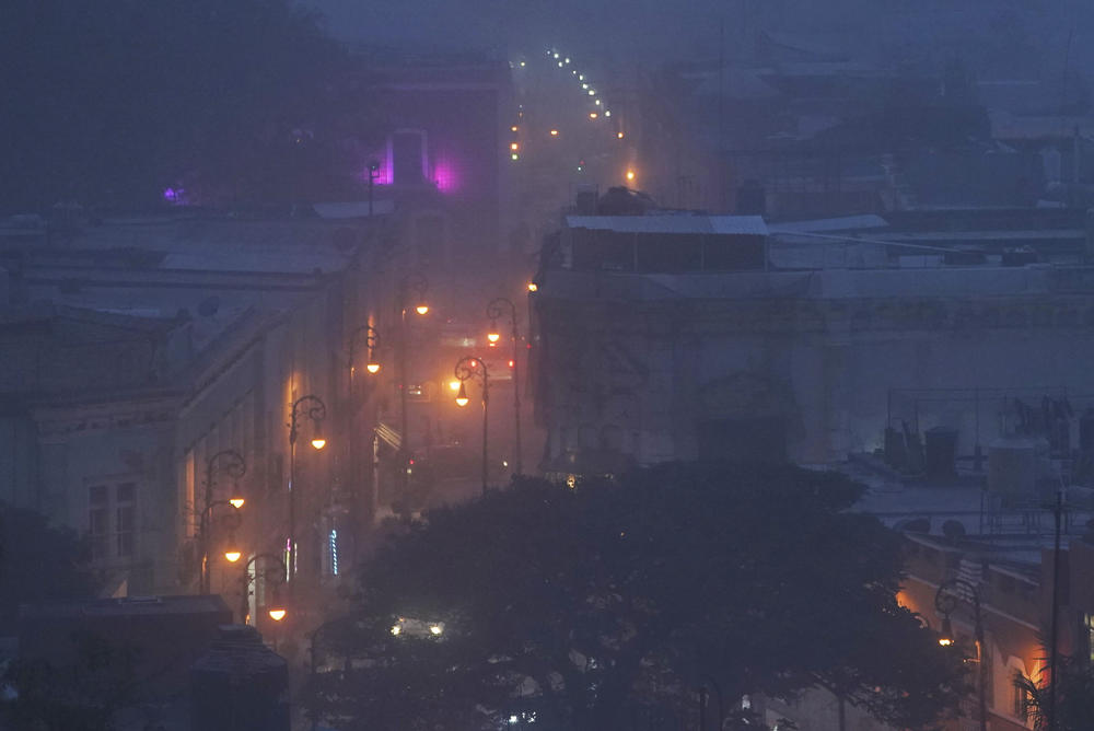 Volcanic ash from the Popocatépetl volcano falls over Atlixco, Mexico, on Monday. Authorities are preparing for possible evacuation and telling people to stay out of a 7.5-mile radius around the peak.