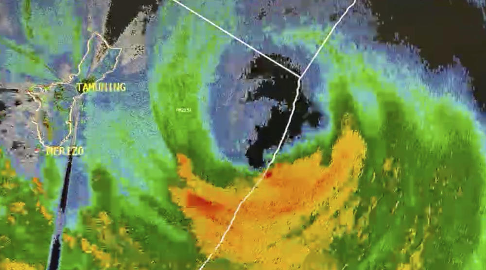 In this image taken from live a satellite video from the U.S. National Weather Service Guam, Typhoon Mawar is seen approaching landfall on Wednesday.