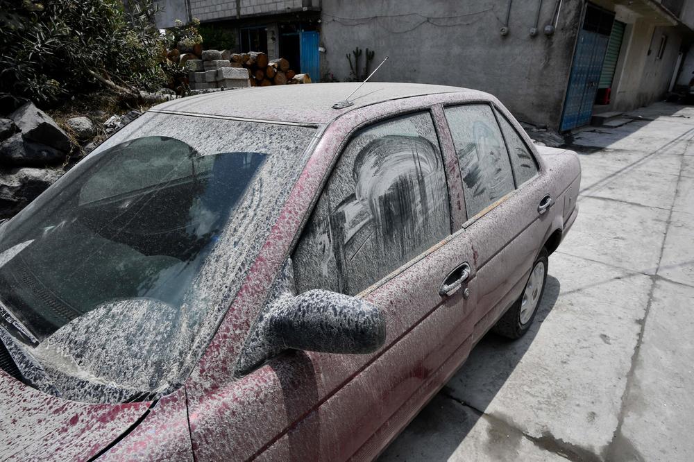A car is covered with ashes Tuesday from the PopocatÃ©petl volcano in the village of Santiago Xalitzintla in Puebla state, Mexico.