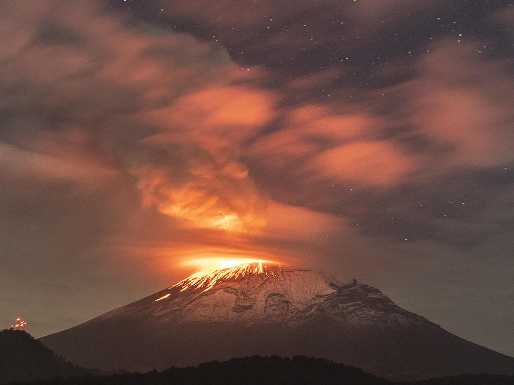 Popocatépetl volcano spews incandescent material on Tuesday. The second highest volcano in the Mexico increased its activity, and authorities raised the alert to the second-highest level.