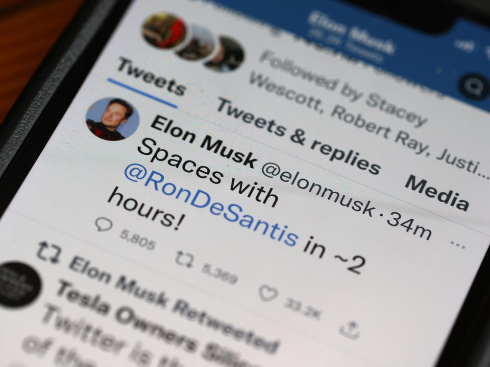 In this photo illustration, businessman and Twitter owner Elon Musk tweets about a Twitter Spaces event he will be hosting with Florida Gov. Ron DeSantis on May 24.