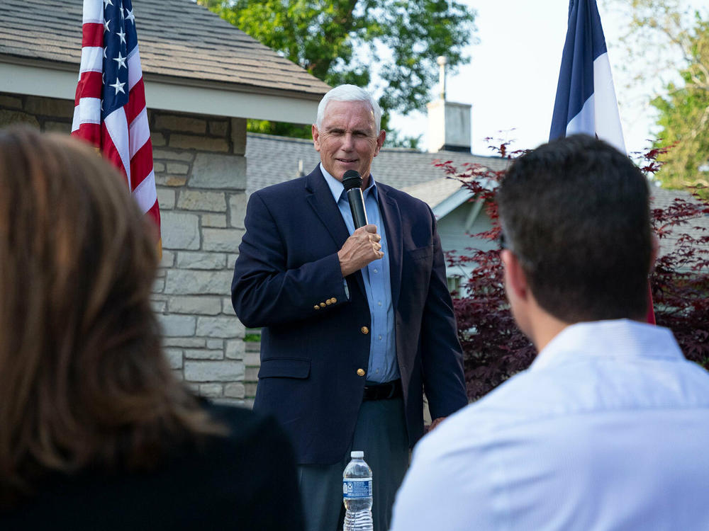 Former Vice President Mike Pence speaks to Iowa voters at a backyard party in Des Moines, Iowa, on May 23.