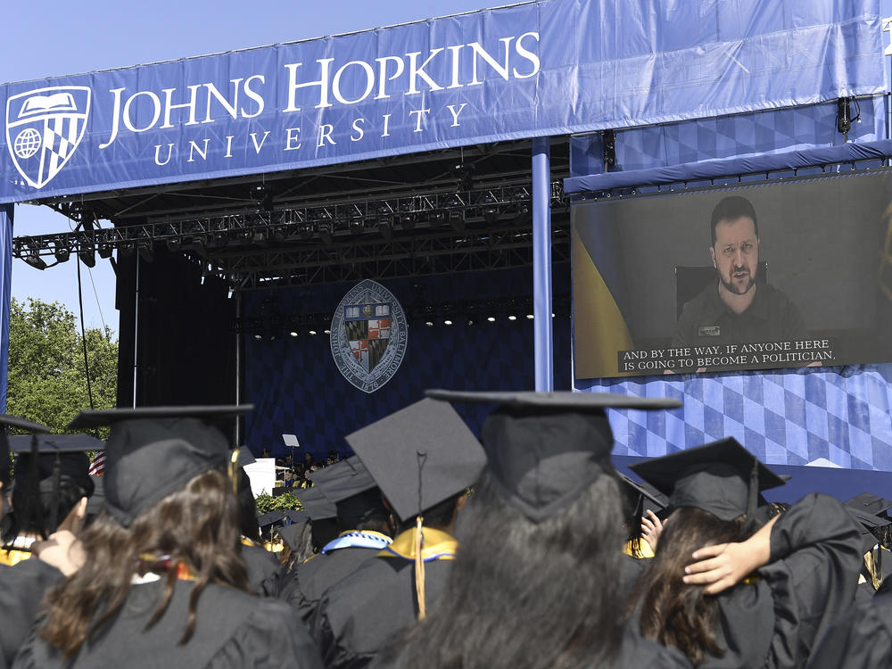 Ukrainian President Volodymyr Zelenskyy addresses the graduating class of Johns Hopkins University via livestream from Ukraine on Thursday in Baltimore.