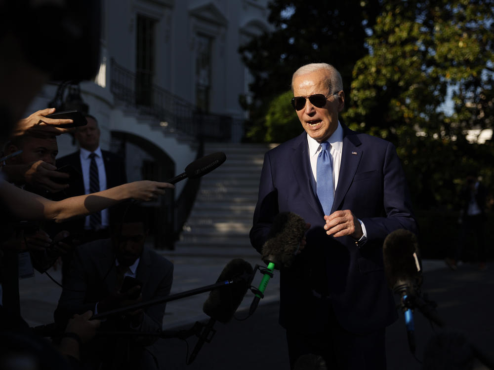 President Biden talks to reporters as he departs the White House for the Memorial Day holiday weekend.