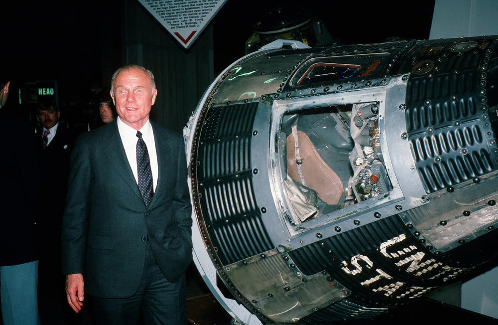 During his campaign for the Democratic presidential nomination, American politician and former astronaut Sen. John Glenn poses beside the Friendship 7 space capsule at the U.S. Space & Rocket Center, Huntsville, Ala., Jan. 18, 1984.