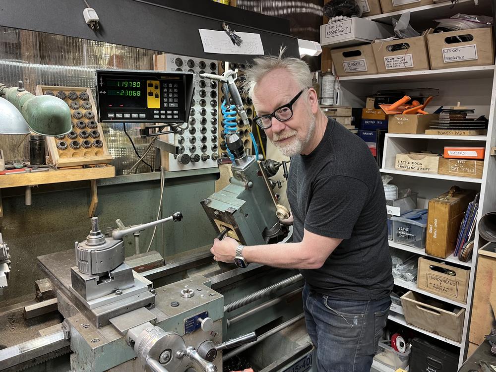 Adam Savage, host of <em>Tested, </em>and right to repair advocate, shows off the lathe he's fixing at his San Francisco workshop.