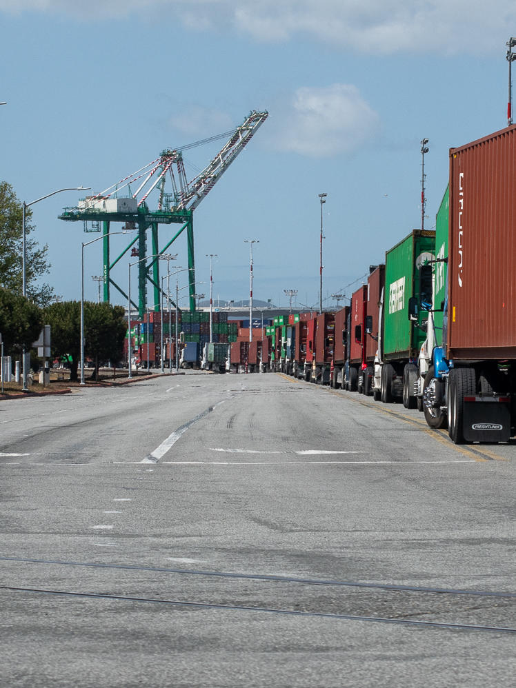Tractor trailers line up to receive their freight at the Port of Oakland on April 12, 2022.