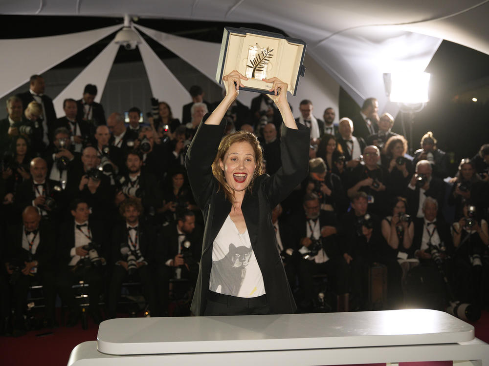 Justine Triet, winner of the Palme d'Or for <em>Anatomy of a Fall</em>, poses for photographers following the awards ceremony at the 76th international film festival in Cannes, southern France, on Saturday.